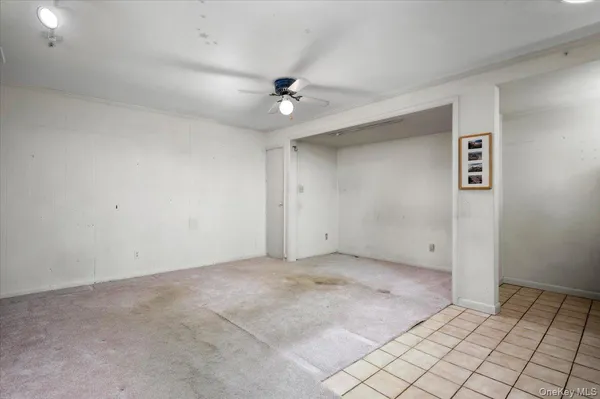 an empty room with carpet