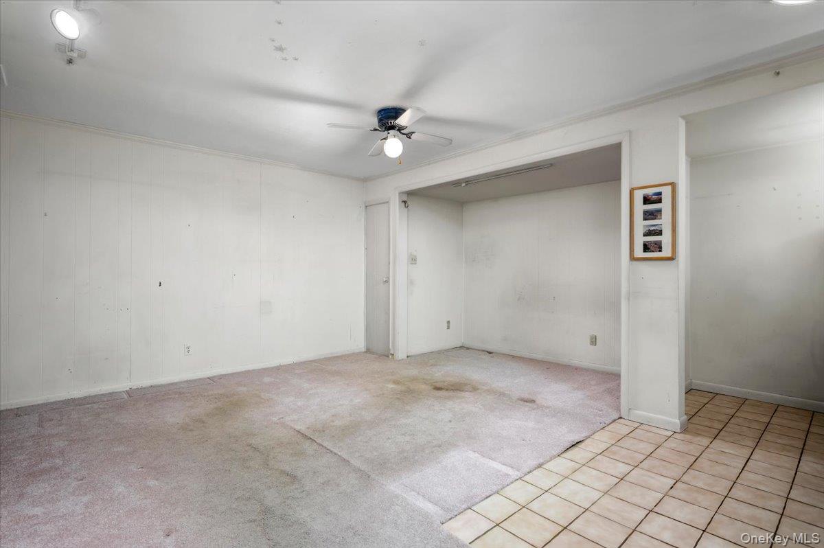 580 Bedford Road, Unit 8 Pleasantville, NY 10570 - Photo 8 of 35 an empty room with carpet