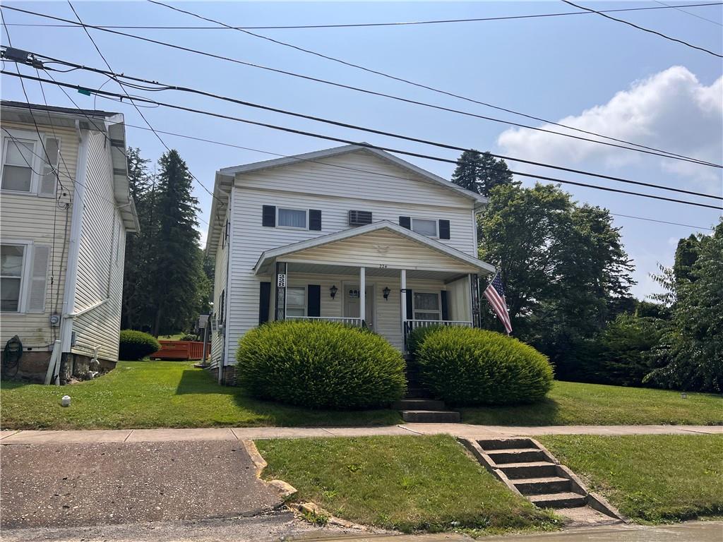 228 East Main Street Dayton, PA 16222 - Photo 1 of 25 a front view of a house with a yard