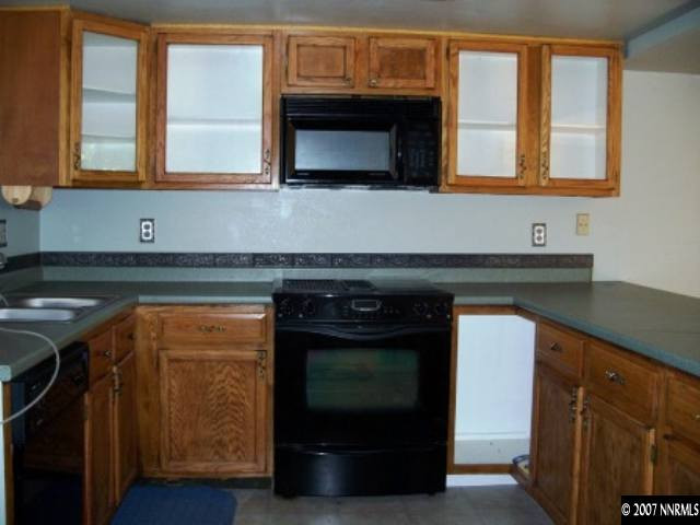 2650 Nicholette Drive Reno, NV 89503 - Photo 2 of 9 a kitchen with granite countertop a stove and a microwave