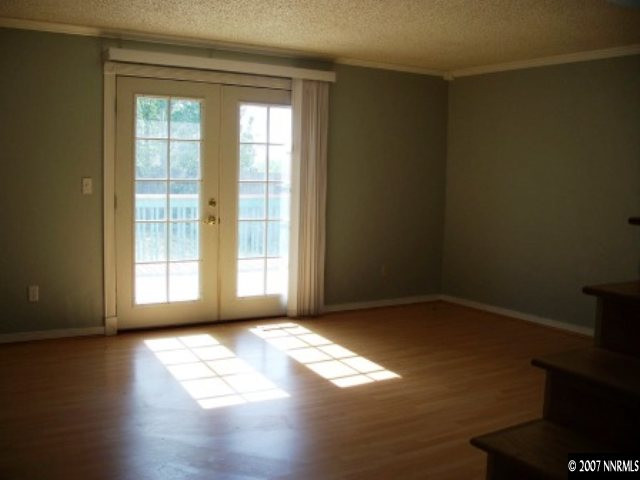 2650 Nicholette Drive Reno, NV 89503 - Photo 3 of 9 a view of empty room with wooden floor and fan