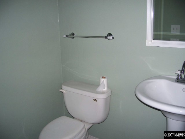 2650 Nicholette Drive Reno, NV 89503 - Photo 7 of 9 a white toilet sitting next to a bathroom sink