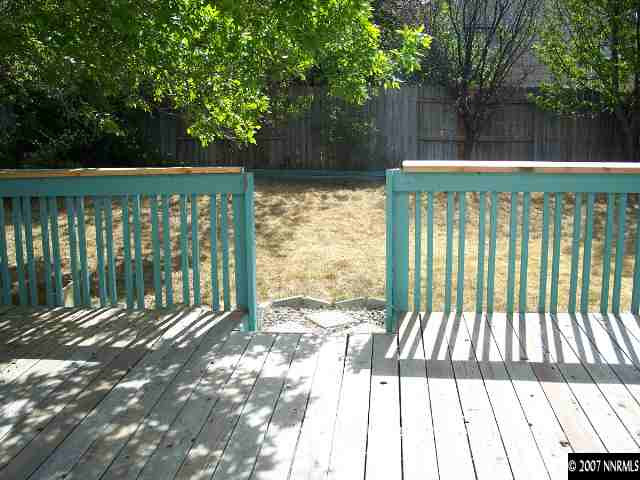 2650 Nicholette Drive Reno, NV 89503 - Photo 8 of 9 a view of backyard with deck and a garden