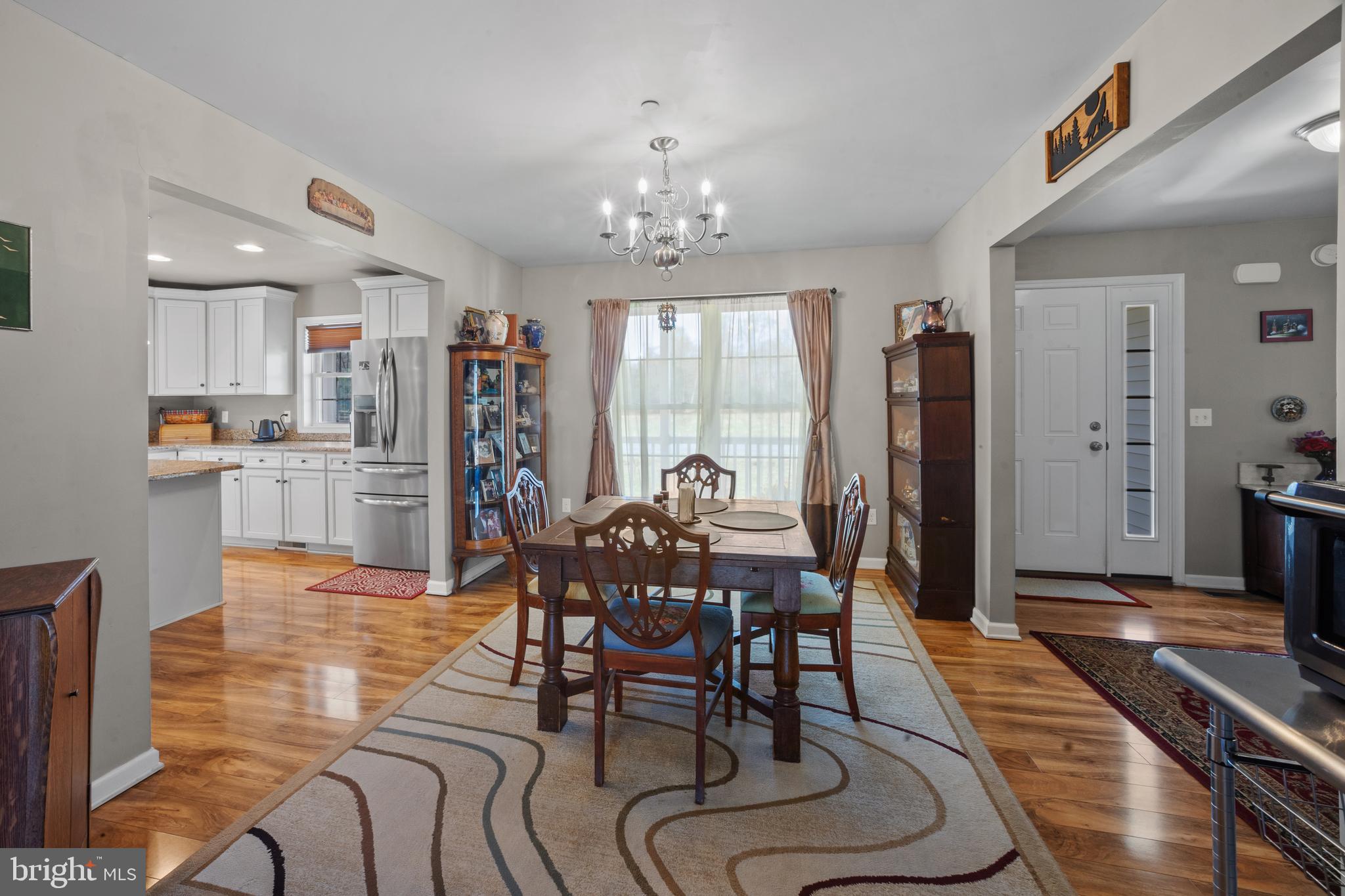 26268 Baker Road Denton, MD 21629 - Photo 11 of 55 a view of a dining room with furniture window and wooden floor