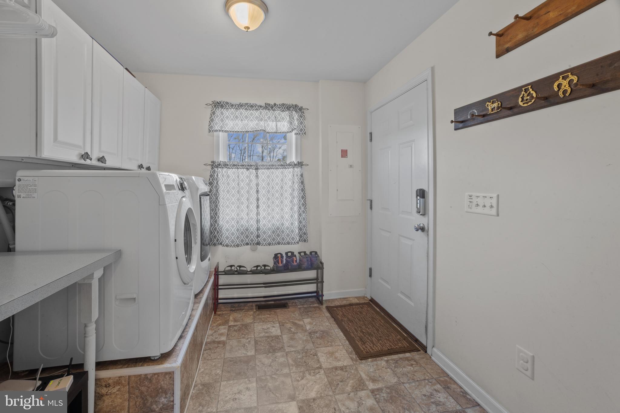 26268 Baker Road Denton, MD 21629 - Photo 17 of 55 a view of entryway with washer and dryer