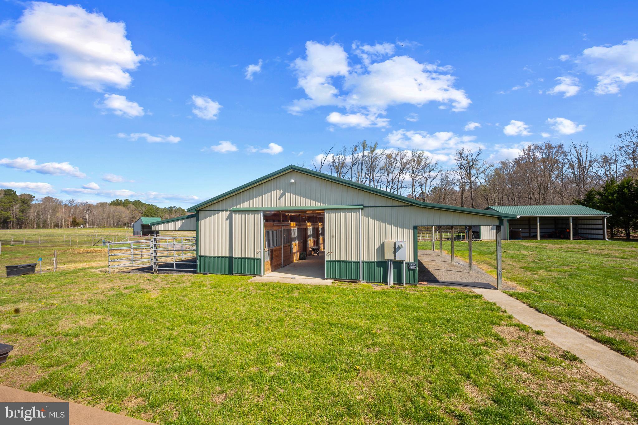 26268 Baker Road Denton, MD 21629 - Photo 2 of 55 a front view of a house with yard and green space