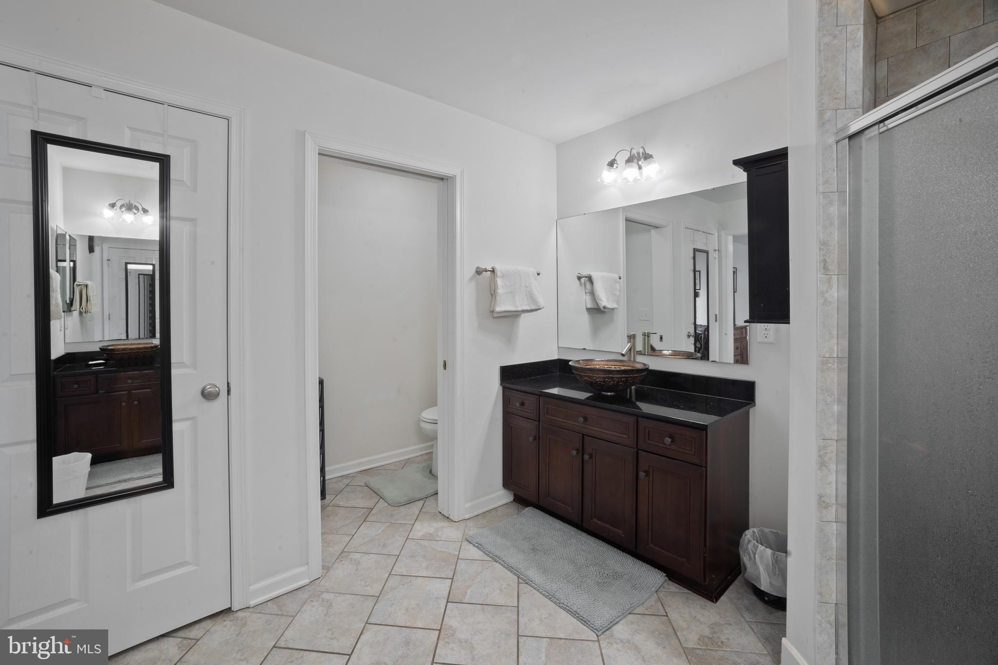 26268 Baker Road Denton, MD 21629 - Photo 29 of 55 a bathroom with a granite countertop sink and a mirror