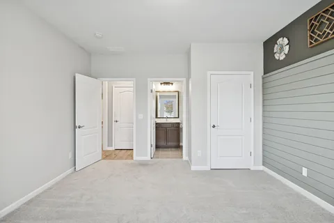 a kitchen with stainless steel appliances granite countertop a stove top oven a refrigerator a sink and a oven with wooden floors