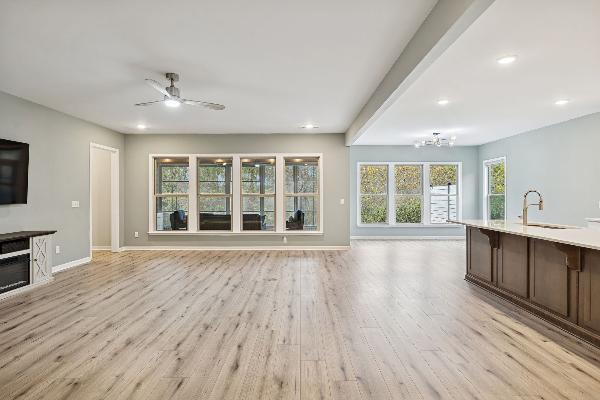 7027 Hickman Way Spring Hill, TN 37174 - Photo 13 of 61 a view of an empty room with wooden floor and a window
