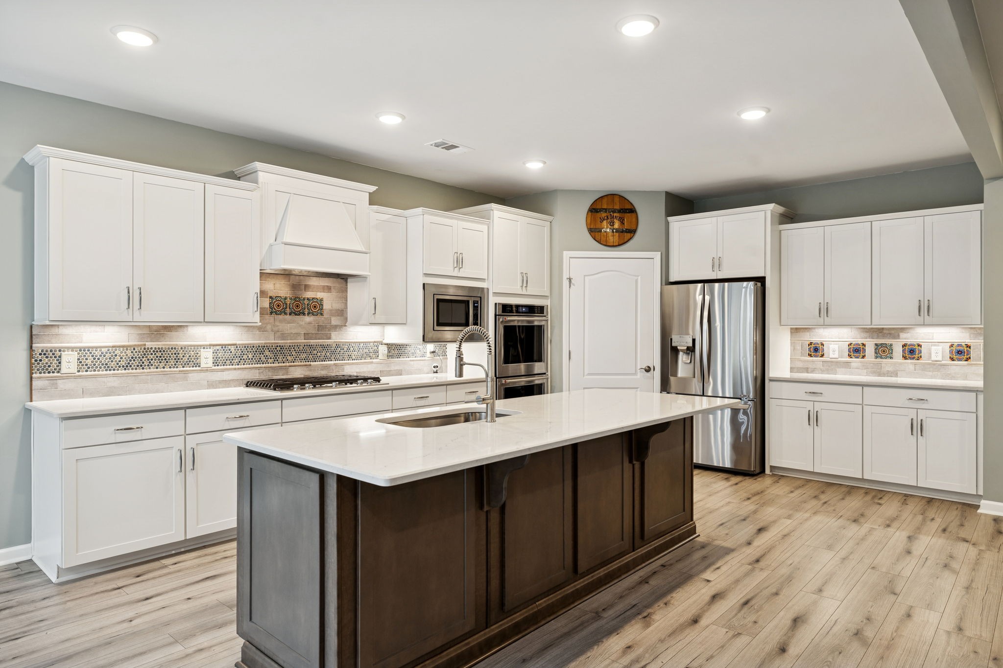 7027 Hickman Way Spring Hill, TN 37174 - Photo 15 of 61 a kitchen with white cabinets stove and sink