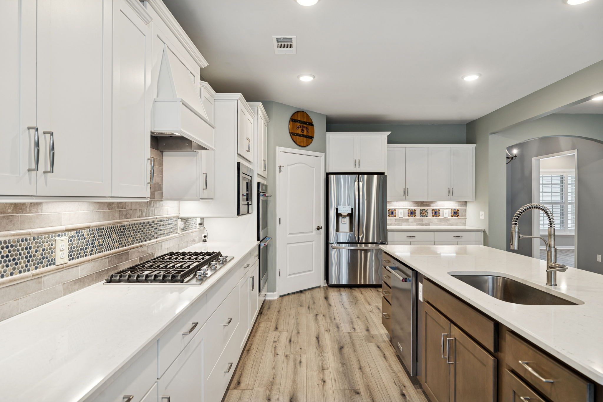 7027 Hickman Way Spring Hill, TN 37174 - Photo 16 of 61 a kitchen with a sink a stove and refrigerator