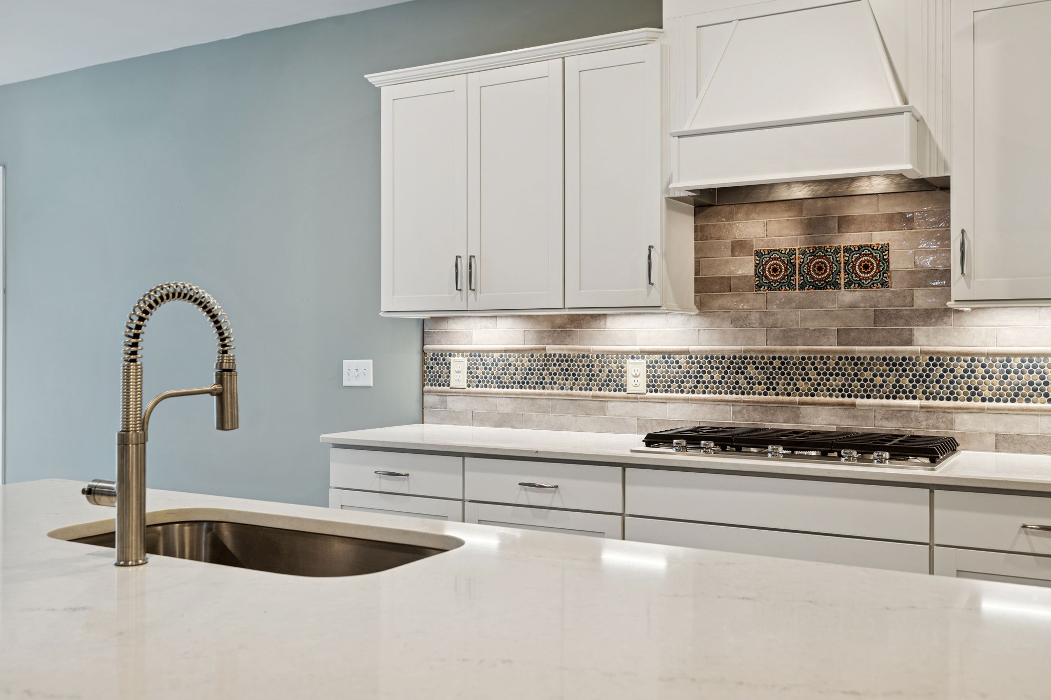 7027 Hickman Way Spring Hill, TN 37174 - Photo 18 of 61 a kitchen with granite countertop a stove and a white cabinets