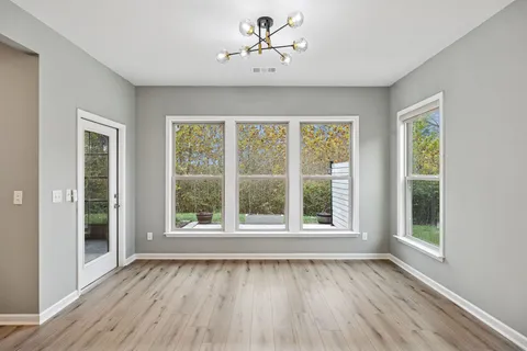 a living room with furniture potted plant and a fireplace