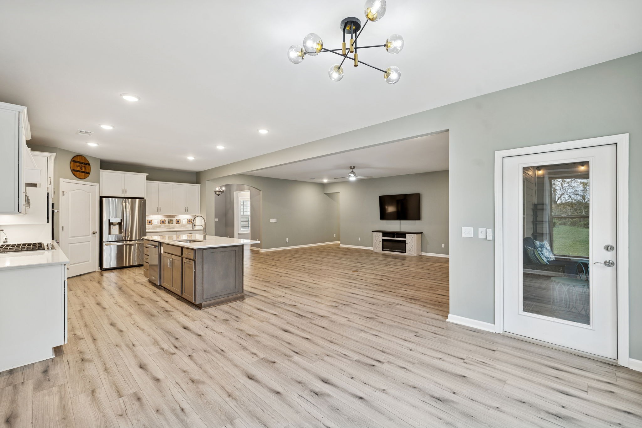 7027 Hickman Way Spring Hill, TN 37174 - Photo 22 of 61 a view of a kitchen with a sink and a refrigerator