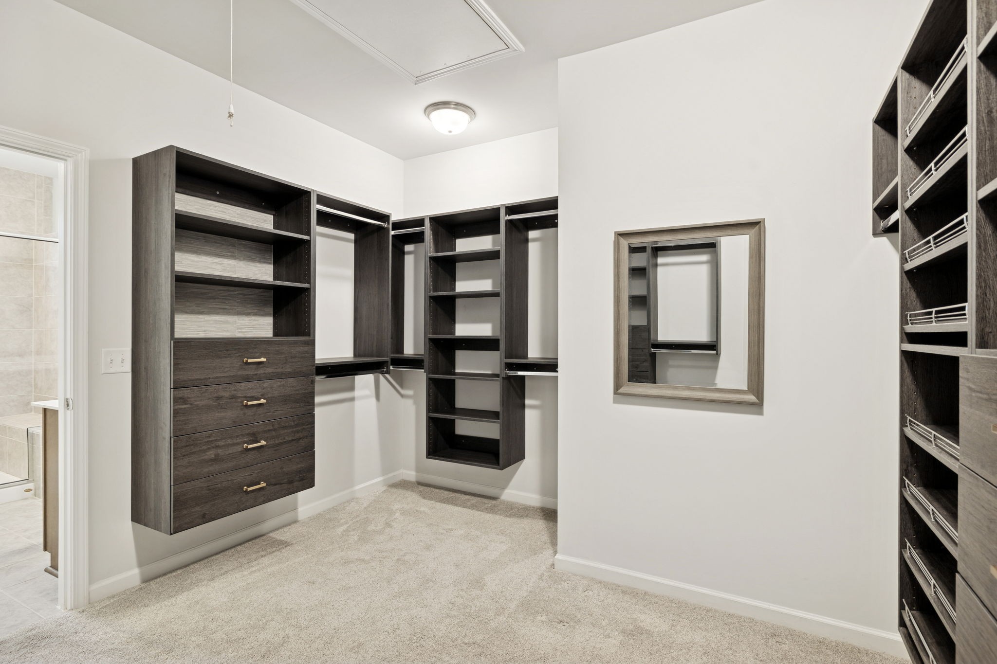 7027 Hickman Way Spring Hill, TN 37174 - Photo 34 of 61 a view of walk in closet with clothes and shoes