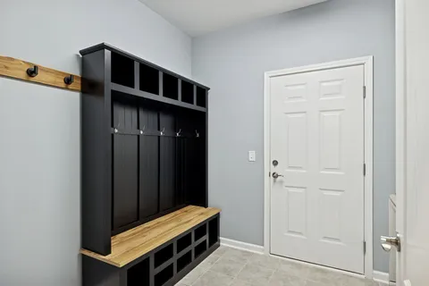 a building outdoor space with patio furniture and potted plants