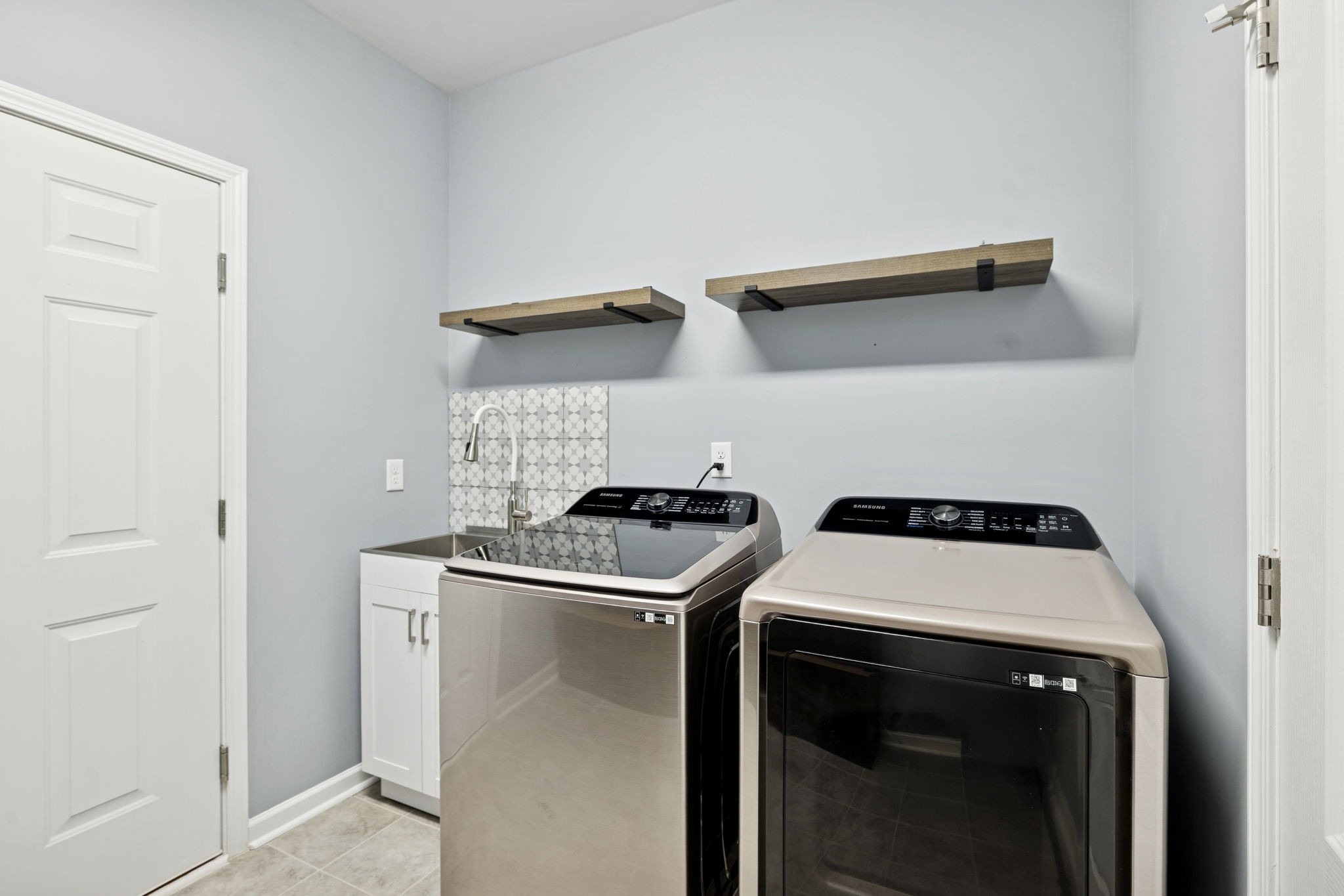 7027 Hickman Way Spring Hill, TN 37174 - Photo 40 of 61 a utility room with dryer and washer