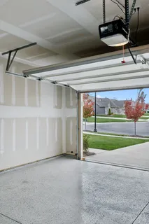 a front view of a house with a yard and outdoor seating