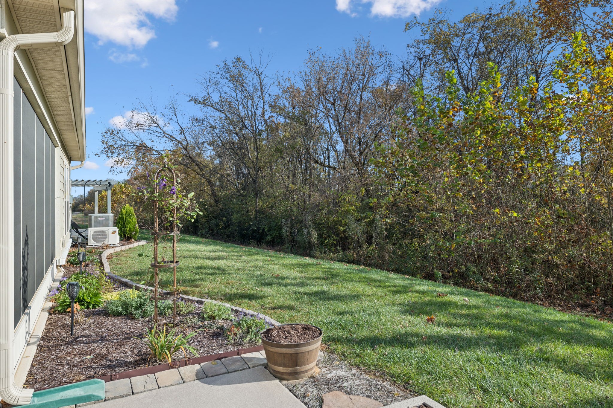 7027 Hickman Way Spring Hill, TN 37174 - Photo 49 of 61 a backyard of a house with lots of green space