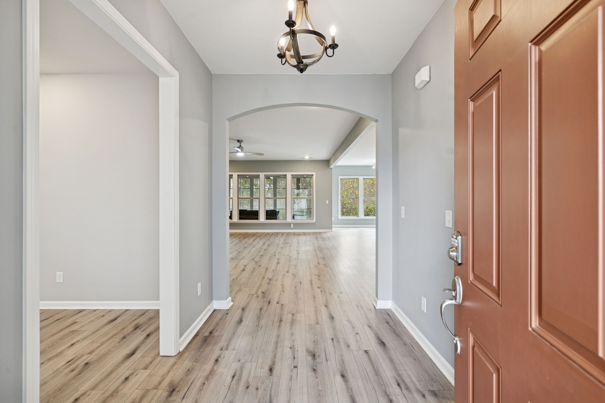 7027 Hickman Way Spring Hill, TN 37174 - Photo 5 of 61 a view of a hallway with wooden floor and staircase
