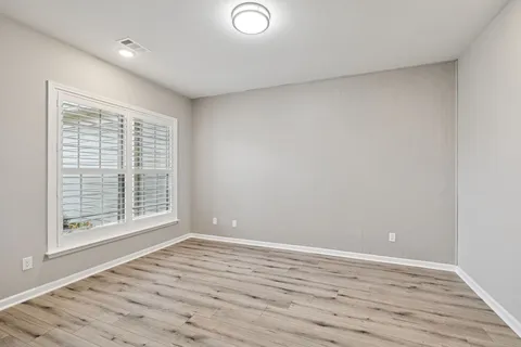 a view of a big room with windows