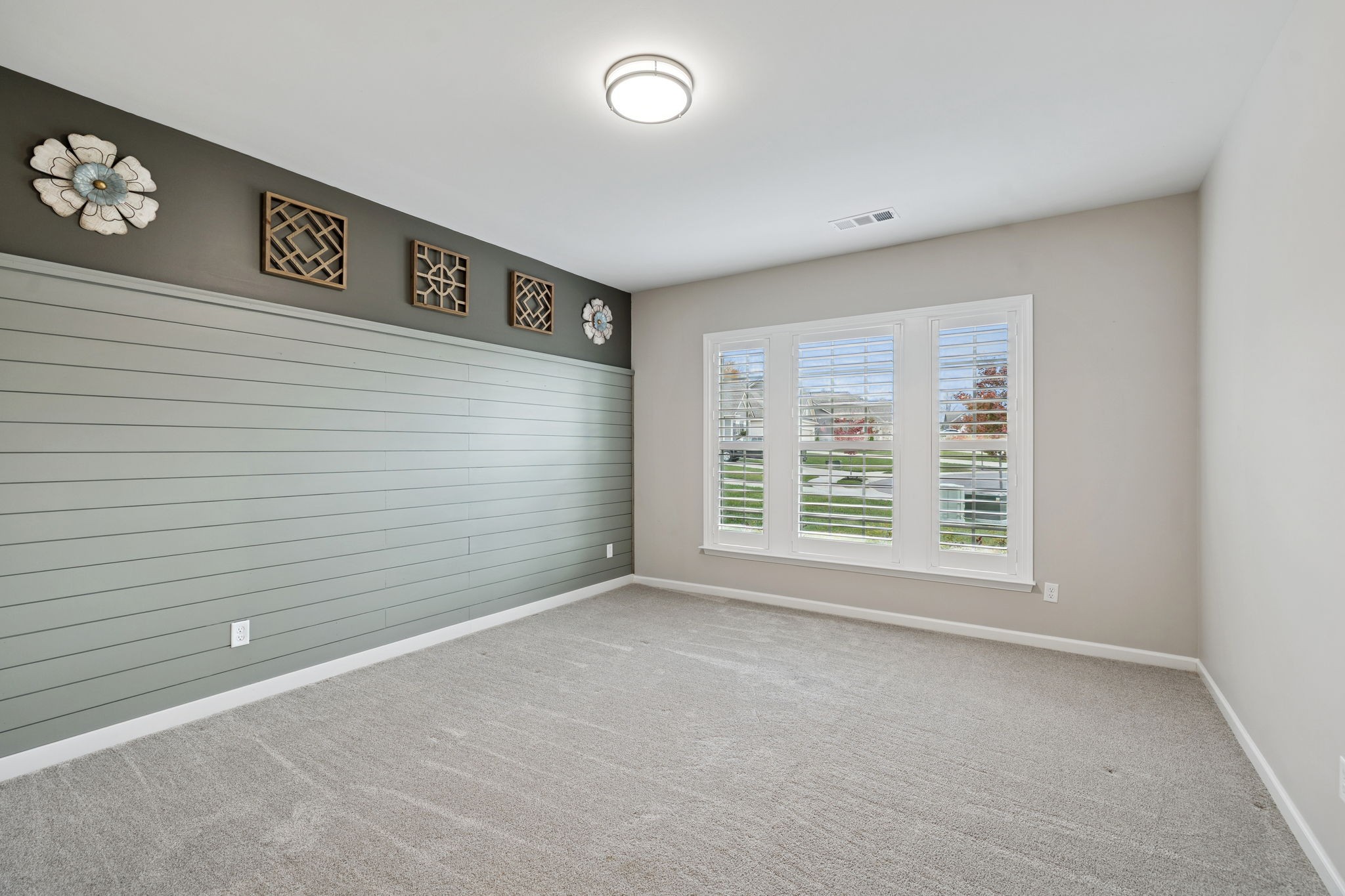 7027 Hickman Way Spring Hill, TN 37174 - Photo 10 of 61 a view of a big room with windows