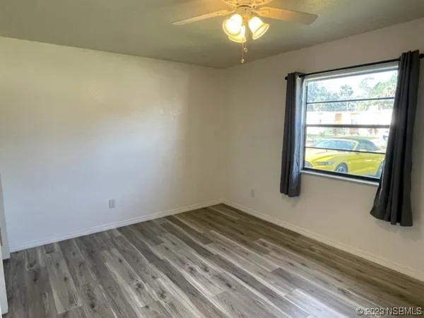 a view of an empty room and window