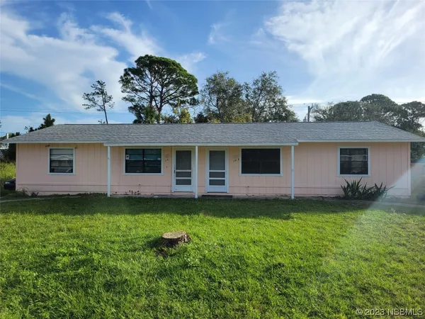 a backyard of a house with lots of green space