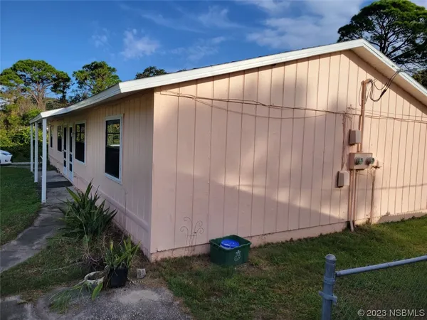 a backyard of a house with plants