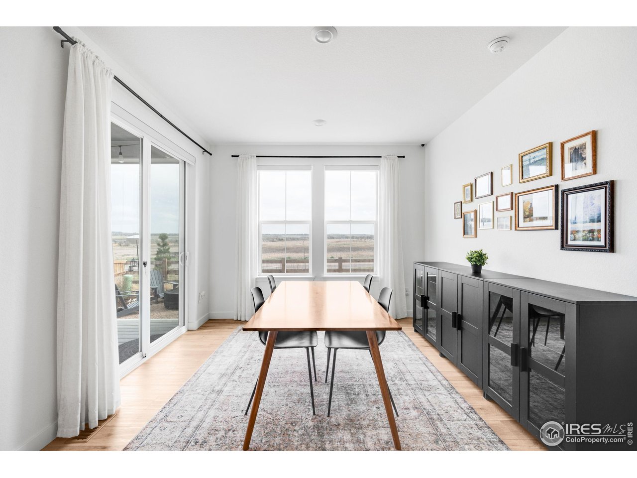 840 Clover Loop Lafayette, CO 80026 - Photo 12 of 39 a very nice looking living room with a large window