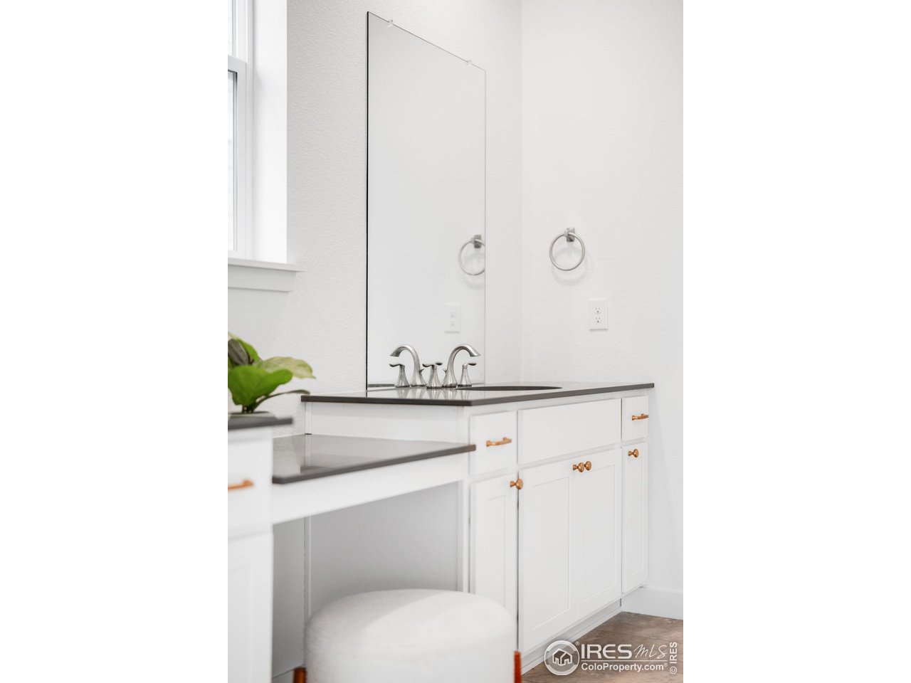 840 Clover Loop Lafayette, CO 80026 - Photo 23 of 39 a bathroom with a toilet and a sink