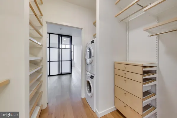 a view of a storage & utility room with cabinets