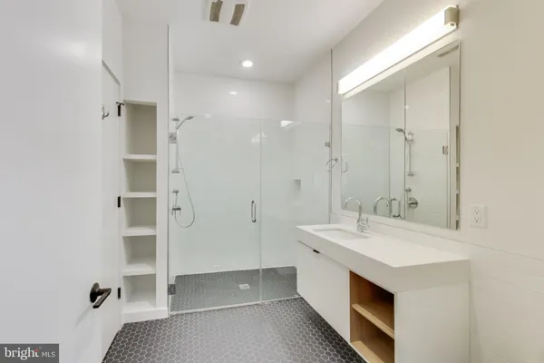 a view of bathroom with dual sinks