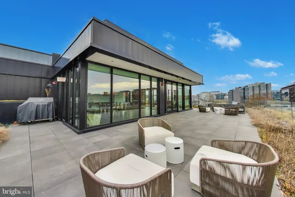 a balcony with table and chairs