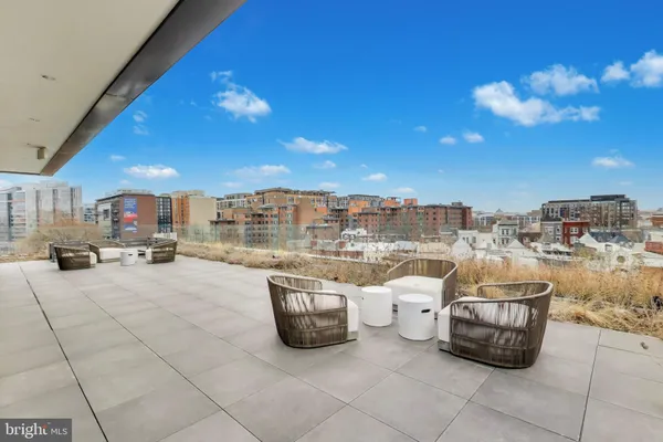 a view of a terrace with furniture