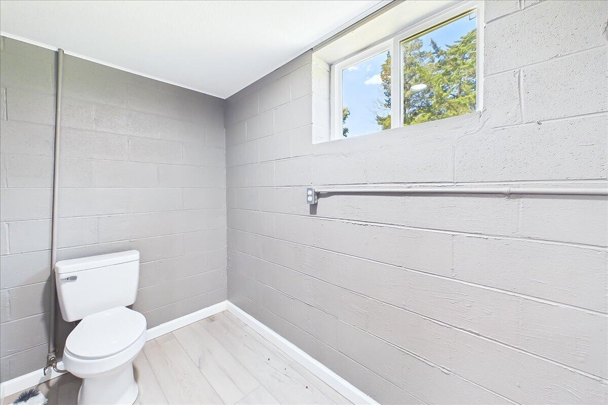 858 Main Street Decatur, TN 37322 - Photo 43 of 65 a bathroom with a toilet and a shower