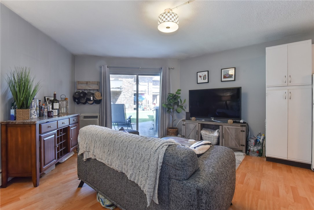 3940 Post Road, Unit 2 Warwick, RI 02886 - Photo 3 of 14 Living room with a slider to a patio.