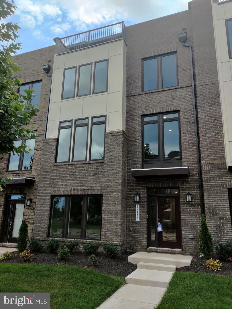 a view of a brick house with a large windows