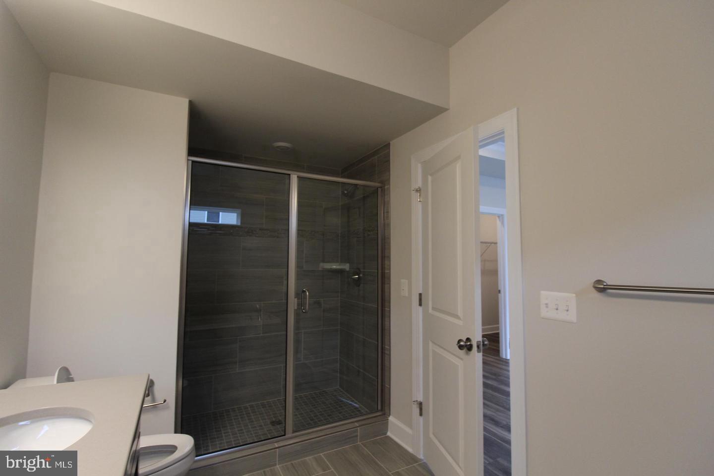 22466 Foundation Drive Ashburn, VA 20148 - Photo 12 of 21 a bathroom with a shower toilet and sink