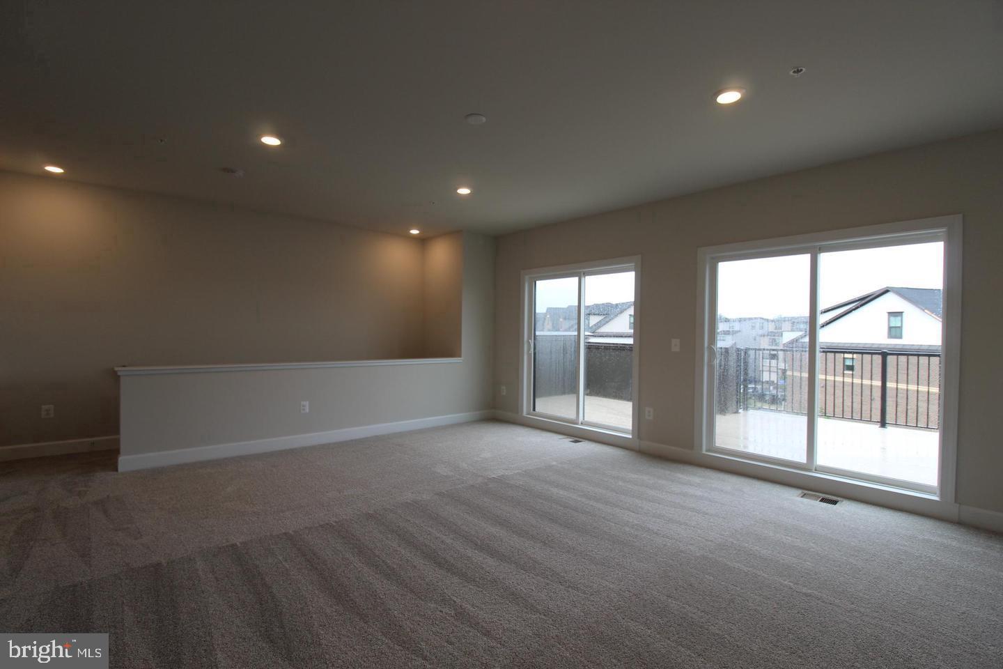 22466 Foundation Drive Ashburn, VA 20148 - Photo 19 of 21 an empty room with wooden floor and windows