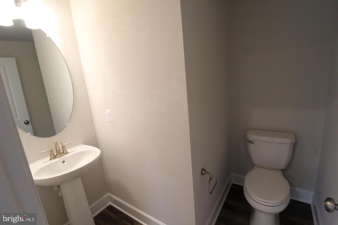 22466 Foundation Drive Ashburn, VA 20148 - Photo 4 of 21 a bathroom with a toilet sink and mirror