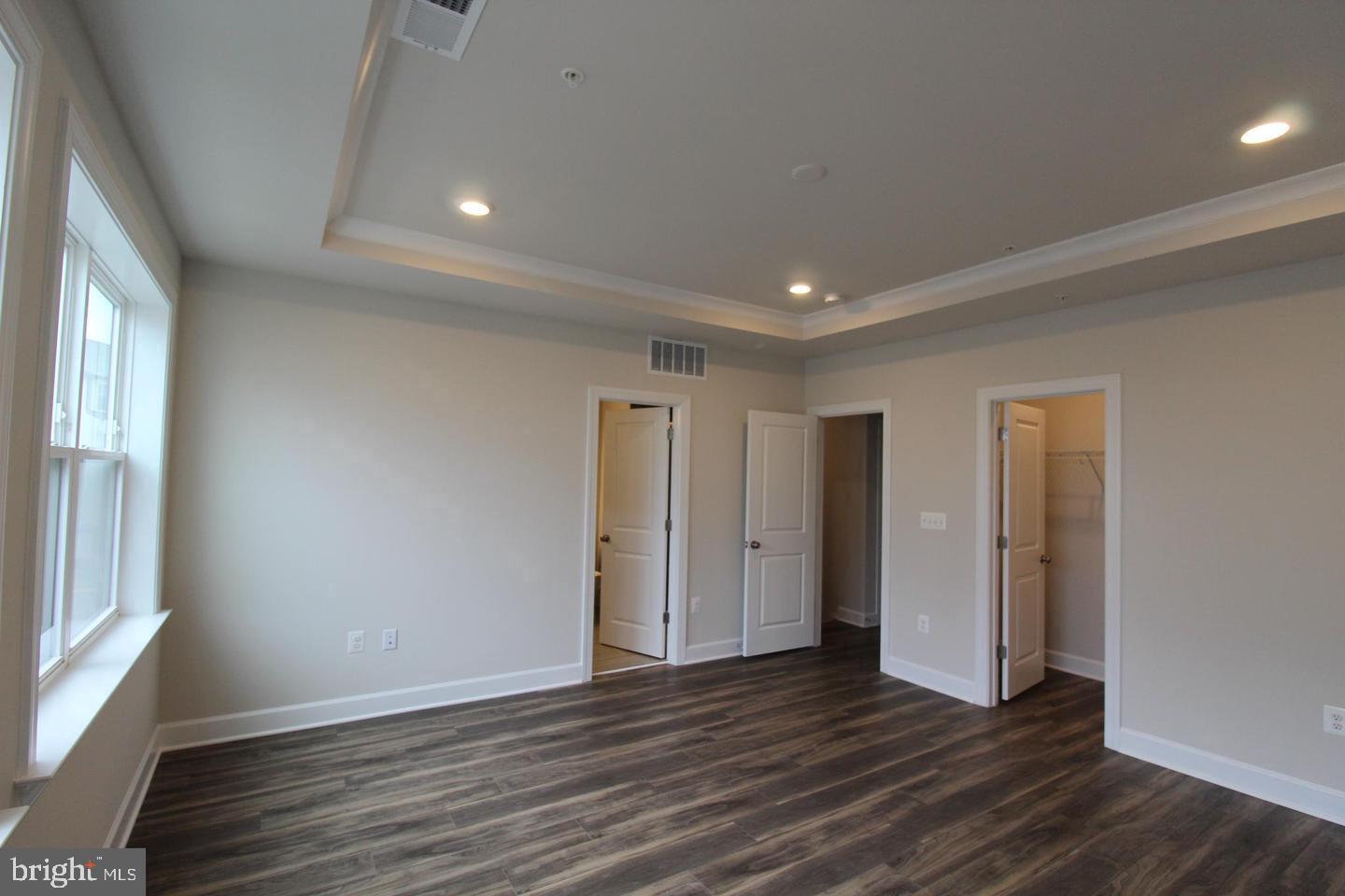 22466 Foundation Drive Ashburn, VA 20148 - Photo 10 of 21 an empty room with wooden floor and windows