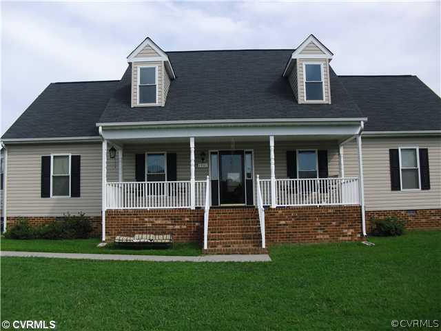 1901 Coxtown Road Crozier, VA 23039 - Photo 1 of 8 a front view of a house with a yard