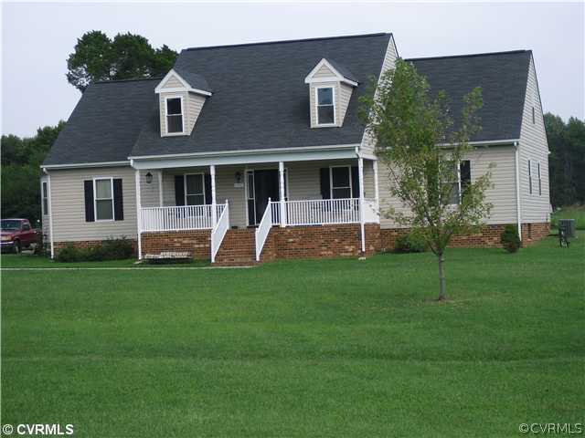 1901 Coxtown Road Crozier, VA 23039 - Photo 2 of 8 a view of a house with a yard