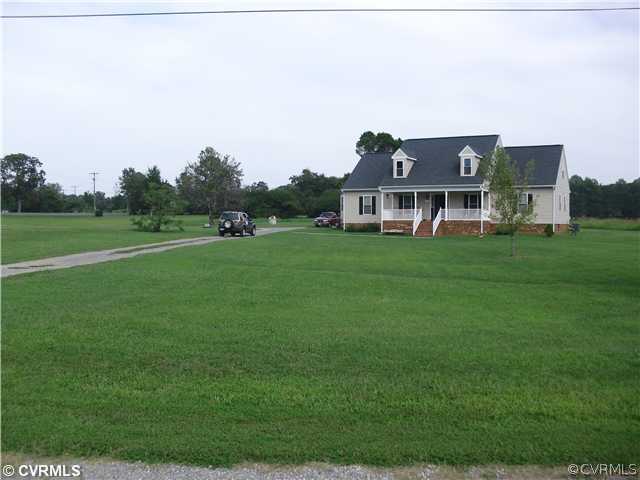 1901 Coxtown Road Crozier, VA 23039 - Photo 3 of 8 a view of a house with a big yard