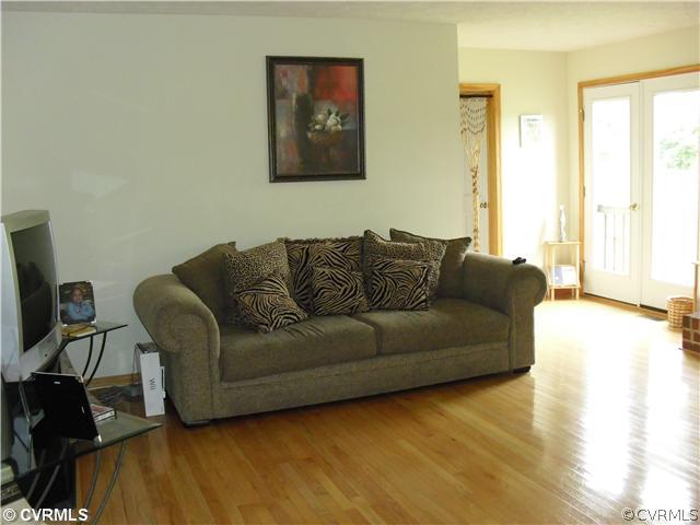 1901 Coxtown Road Crozier, VA 23039 - Photo 4 of 8 a living room with furniture and a wooden floor