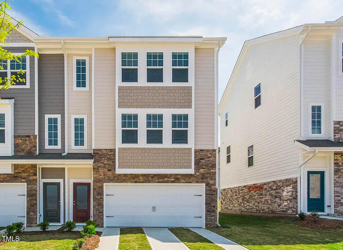 6914 Woodland Stream Place Raleigh, NC 27616 - Photo 12 of 12 front view of a house with a yard