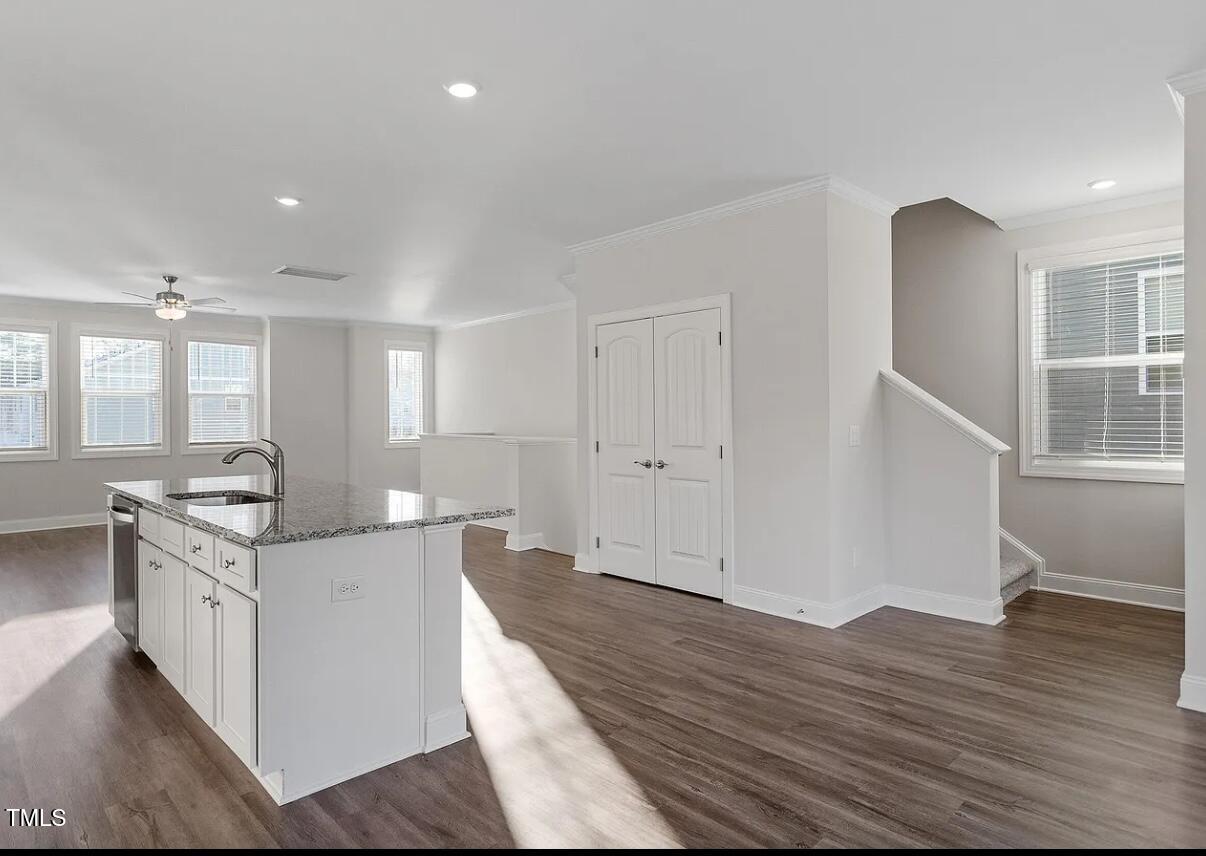 6914 Woodland Stream Place Raleigh, NC 27616 - Photo 2 of 12 a open kitchen with stainless steel appliances granite countertop a stove and a refrigerator