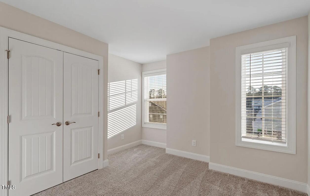 6914 Woodland Stream Place Raleigh, NC 27616 - Photo 8 of 12 a view of an empty room with a window