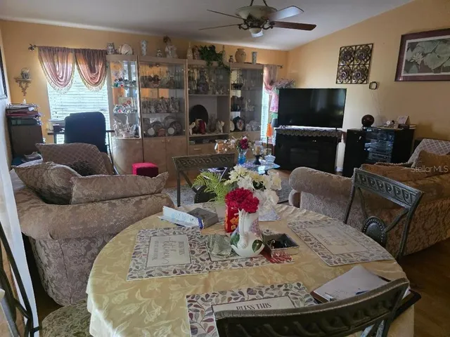 a living room with fireplace furniture and a flat screen tv